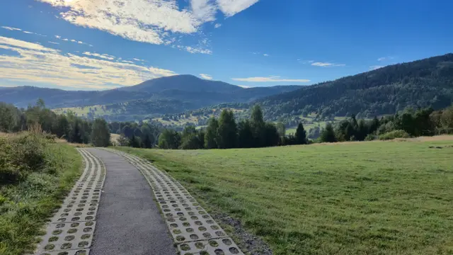 Paved Track Toward the Rounded Peak