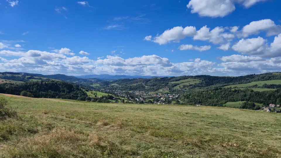 Valley Town Under Layered Beskids