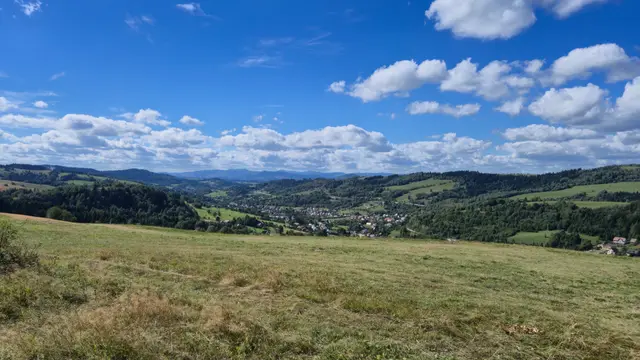 Valley Town Under Layered Beskids