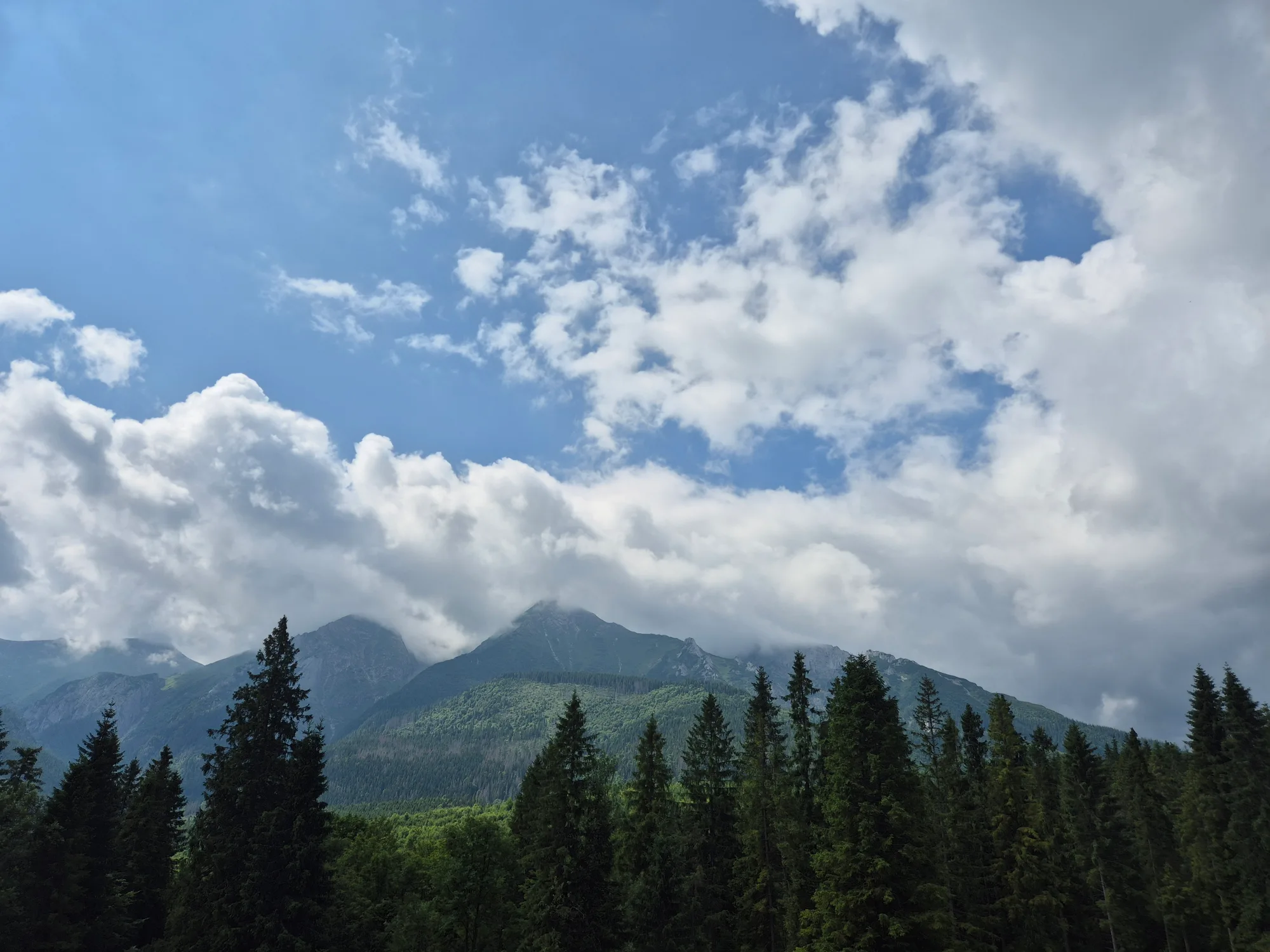 Cloud-Wrapped Triangular Peak
